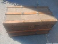 Full view of antique steamer trunk top and front