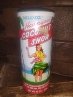 Front of Mele-Koi Hawaiian Coconut Snow tin showing branding and graphics