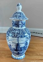 Full view of lidded blue and white Delft vase