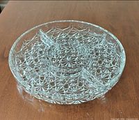 Angled view showing three-section crystal snack server and central well