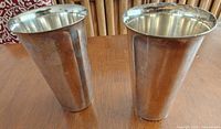 both silver plated tumblers side by side