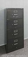 Full front view of the 4-drawer steel filing cabinet showing drawers and lock