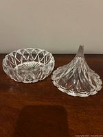 Two-piece crystal candy dish base and lid displayed side by side