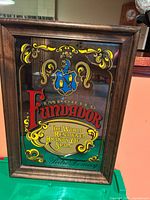Front view of Fundador mirrored sign in frame
