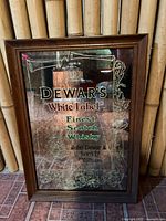 Front view of framed Dewar’s advertising mirror