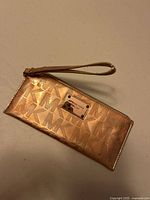 Full view of wristlet front with strap