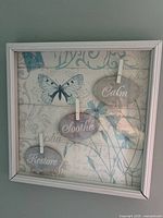 Front view of framed wall art showing full design