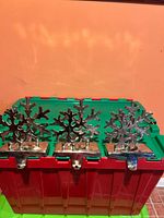 Front view showing three snowflake stocking holders standing on tote