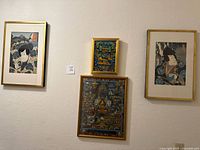 Overall view of four framed Asian artworks on wall