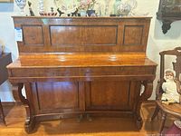 Front view of Bruner & Lau upright piano
