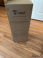 Full view of boxed Neat AquaPad water heated mattress pad standing upright