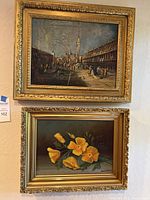 Both framed oil paintings displayed together on wall