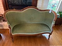 Front view showing upholstery color, shape and overall condition