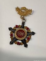 Front view of medal showing design and colors