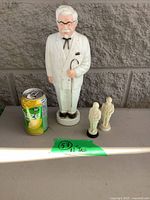 Large 12 in Colonel Sanders statue with two small figurines and soda can for scale