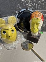 Group shot showing mouse jar, carved head, octagonal mirror, bowls stack, brass hand mirror