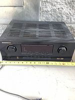 Front view of Marantz SR4200/U1B receiver showing knobs, display, buttons, attached power cord