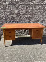 Full front view of double-pedestal desk showing overall structure