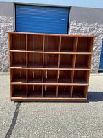 Front view of entire cubby bookcase showing 20 compartments.