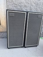 Front view of matching pair of Sony speakers with metal mesh grilles