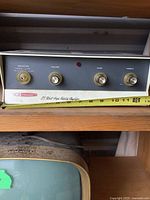 Front view showing full amplifier faceplate, ruler indicating width about 13 in