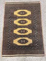 Full view of yellow and brown Pakistan wool rug
