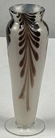 Full view of vase showing feather design and shape