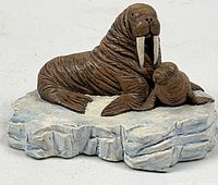 Front view of ceramic walrus and pup on ice base