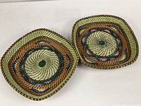 Two matching square multicolor baskets, top view