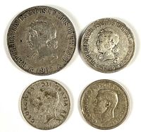 Obverse of four silver coins: 1901 and 1906 Brazil Réis, two Canadian 25 c with George VI portrait