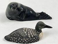 Both figurines side by side showing overall size and shape