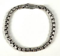 Full view of sterling silver link bracelet laid flat in oval shape