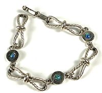 Full view of sterling silver bracelet with twisted rope links and opal stations