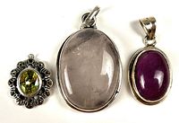 Front view of three sterling silver pendants together