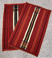 Both tablecloths laid flat displaying full pattern