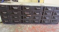 Front view showing all 27 drawers and wear