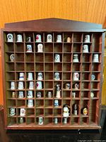 full view of display case with thimbles
