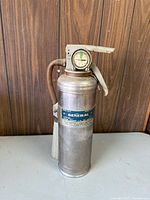 Front view showing label, gauge, hose, overall condition