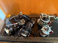 Group shot of five reels on tabletop