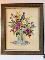 Full view of framed floral crewel needlework