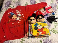 Overview of sweatshirt, slippers, folded linens, and teapot