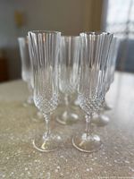 Eight Waterford cut crystal champagne flutes front angle