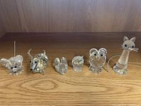 Group shot of six Swarovski crystal figurines
