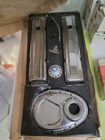 Full kit in original tray showing valve covers, timing cover, and accessories