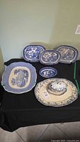 Group view showing the three Davenport Blue Willow oval platters