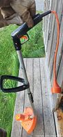 Full view of Black & Decker corded string trimmer showing handle, shaft and guard