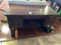 front view of oak desk showing overall structure and drawers