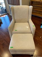 Front view of fabric swivel chair with ottoman