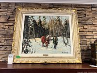 Full view of framed painting on shelf