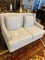 Front view of platinum fabric loveseat with two seat cushions and two back cushions